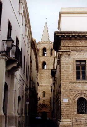 The Cathedral Tower in Alghero seen from via Principe Umberto, Sardinia, Italy