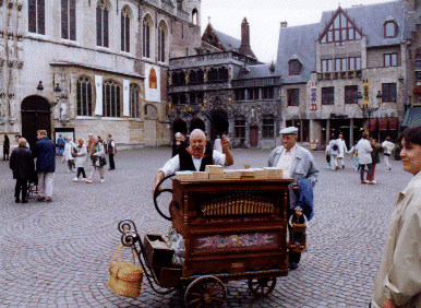 Barrel Organist outside the Holy Blood Basilica in the Burg Square, Brugge, Belgium