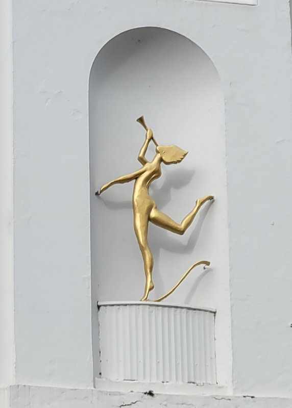 Art Deco Figure on a building in Cheltenham, Gloucestershire